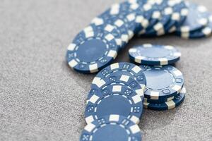 Blue poker chips on stock market chart background photo