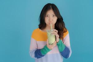 Young woman enjoying bubble tea photo