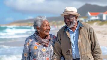 Portrait of african american senior couple walking on the beach at the day time photo