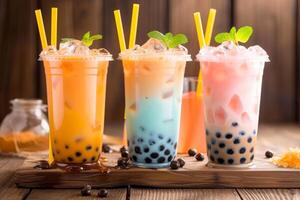 Assorted bubble tea varieties on wooden table photo