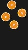 an illustration of orange fruit falling from top to bottom on a black background. Suitable for accessories for content related to fruit and health video