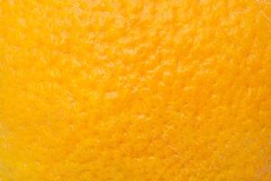 Bright orange peel as background, texture photo