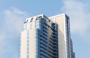 Modern office building with blue sky background photo