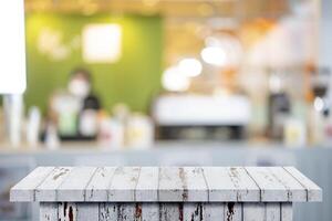 Wood table background, Shelf at cafe shop, Perspective wood over blur cafe photo