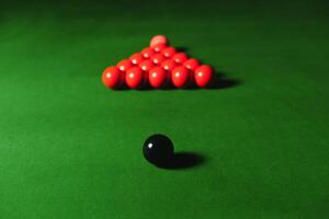 snooker balls set on a green table photo