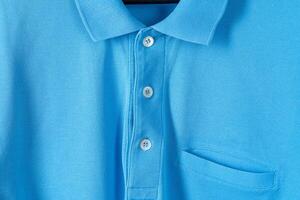 Blue cotton polo t-shirt texture close up photo