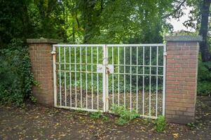 large locked old garden gate photo