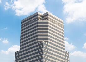 Modern office building with blue sky background photo