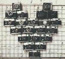 Old retro cameras in heart love photography shape photo