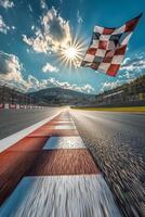 Racing flag waves over the finish line at a motorsport circuit under a bright sun photo