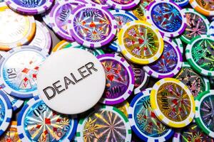 poker chips and cards on black background photo