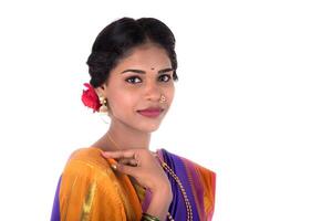 Beautiful Indian young girl posing in traditional Indian saree on white background. photo