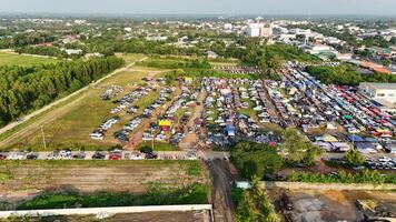 An aerial view of a large parking lot with lots of cars photo