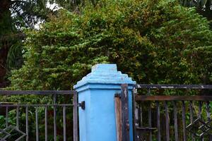 photography of iron fence and rusty damaged walls photo