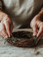 Artisan craftsman creates a natural wreath for decoration photo