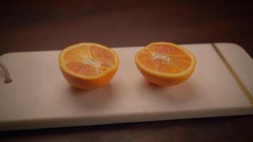 Delicious Fresh Orange Halves Beautifully Arranged on a Rustic Wooden Board for Presentation video