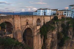 Puente Nuevo Bridge Spanning El Tajo Gorge in Ronda, Spain at Dusk photo