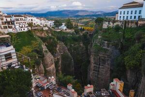 Ronda's El Tajo Gorge with Whitewashed Buildings and Rolling Hills photo