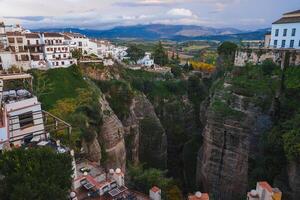 Ronda's El Tajo Gorge with Whitewashed Buildings and Mountains photo