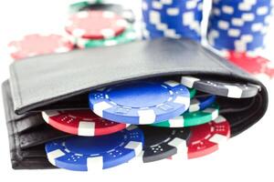 poker chips in black leather purse photo