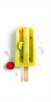 Refreshing tropical popsicle with lime and raspberry placed on ice cubes in sunny weather photo