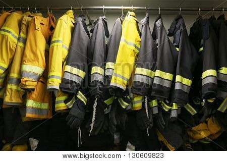 firefighter suit and equipment ready for operation, Fire fighter room for store equipment, Protection equipment of fire fighter.