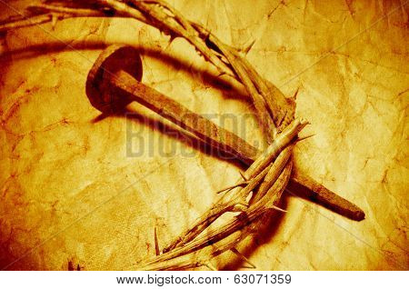 a nail and the Jesus Christ crown of thorns, with a retro filter effect