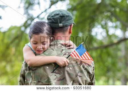 Soldier reunited with his daughter on a sunny day