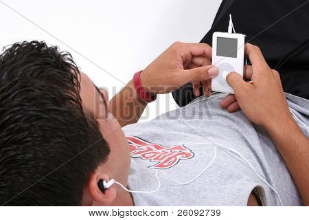 Attractive Young Man Listening To Music.