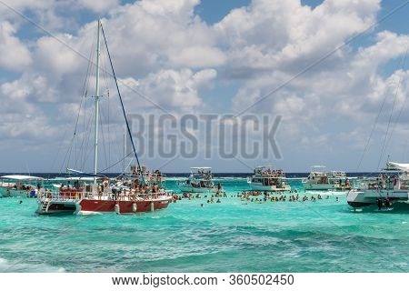 George Town, Grand Cayman Islands, United Kingdom - April 23, 2019: People Enjoy Playing With The St