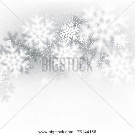 Blurred winter background with defocused snowflakes. Christmas illustration. 