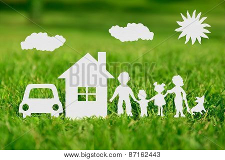 Paper Cut Of Family With House And Car On Green Grass