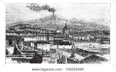 Mount Etna in Sicily, Italy, during the 1890s, vintage engraving. Old engraved illustration of Mount Etna as viewed from Catania City. Trousset encyclopedia (1886 - 1891).