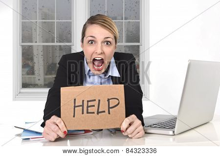 Young Stressed Businesswoman Holding Help Sign Overworked At Office Computer