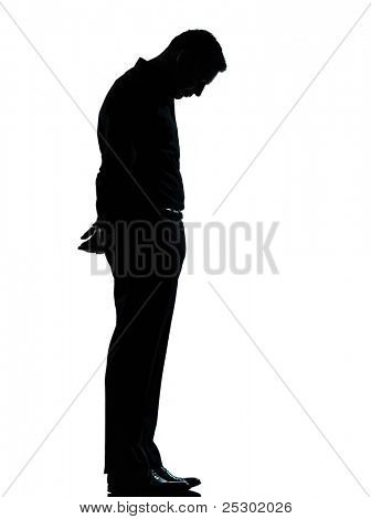 one caucasian business man sad lonely silhouette standing Full length in studio isolated on white background