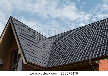 Modern Roof Covered With Tile Effect Pvc Coated Brown Metal Roof Sheets.