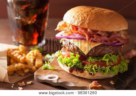 bacon cheese burger with beef patty tomato onion cola