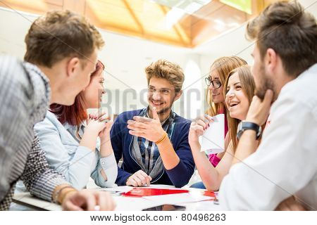 Image of business friends discussing brainstorming and ideas at meeting inside beautiful modern building place