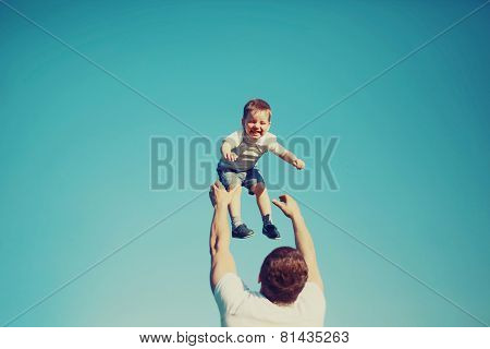 Vintage Photo Happy Father And Child Having Fun Outdoors