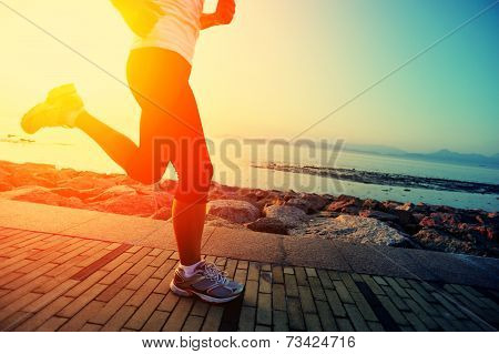 Runner athlete running at seaside.