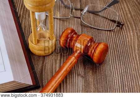 Open Law Book With A Wooden Judges Gavel On Table In A Courtroom Or Law Enforcement Office Justice S