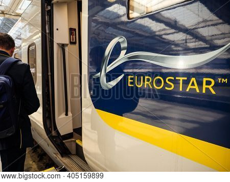 London, United Kingdom - May 18, 2018: Rear View Of Passenger Male With Backpack Entering The Large 