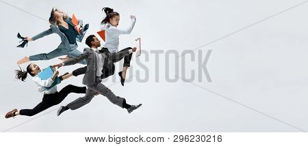 Happy Businesswoman And African Man Dancing In Motion Isolated On White Studio Background. Flexibili