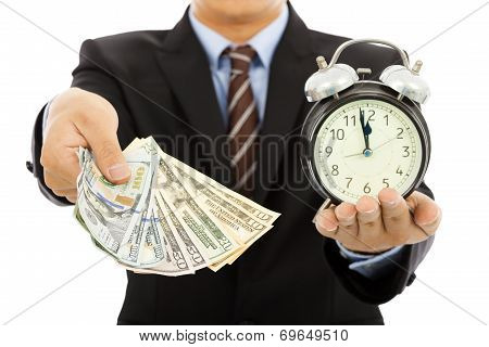 Businessman Holding Money And Clock. Time Is Money Concept