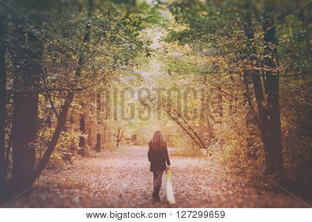 Sad Lonely Woman Walking Alone into the Woods