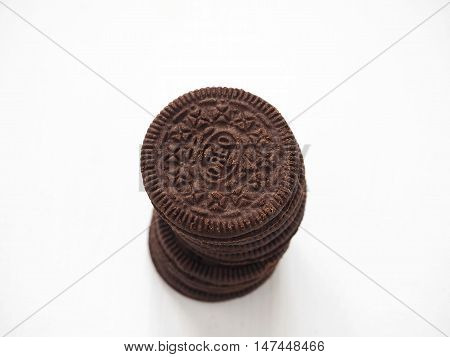 Novgorod, Russian Federation - September 5, 2016: A stack of fresh cream filled chocolate sandwich cookies. Selective focus on the top of the pile.