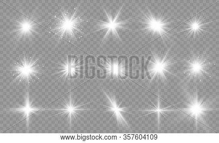 Set Of Bright Stars On A Transparent Background. Sparkling Magic Dust Particles. Set Of White Glowin