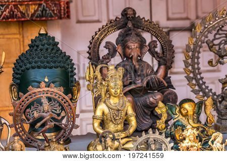 Jaisalmer Rajasthan India miniature bronze statuettes on the market counter