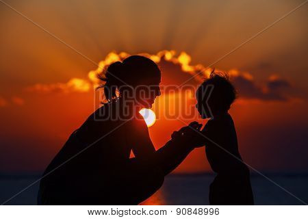 Happy Mother And Joyful Son Sunset Silhouette