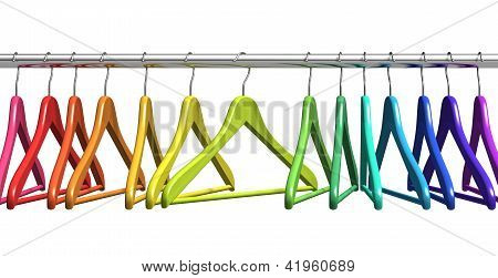 Rainbow coat hangers on clothes rail